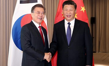 Полдневная Корея и Китай сговорились постановить кризис вкруг КНДР мирно